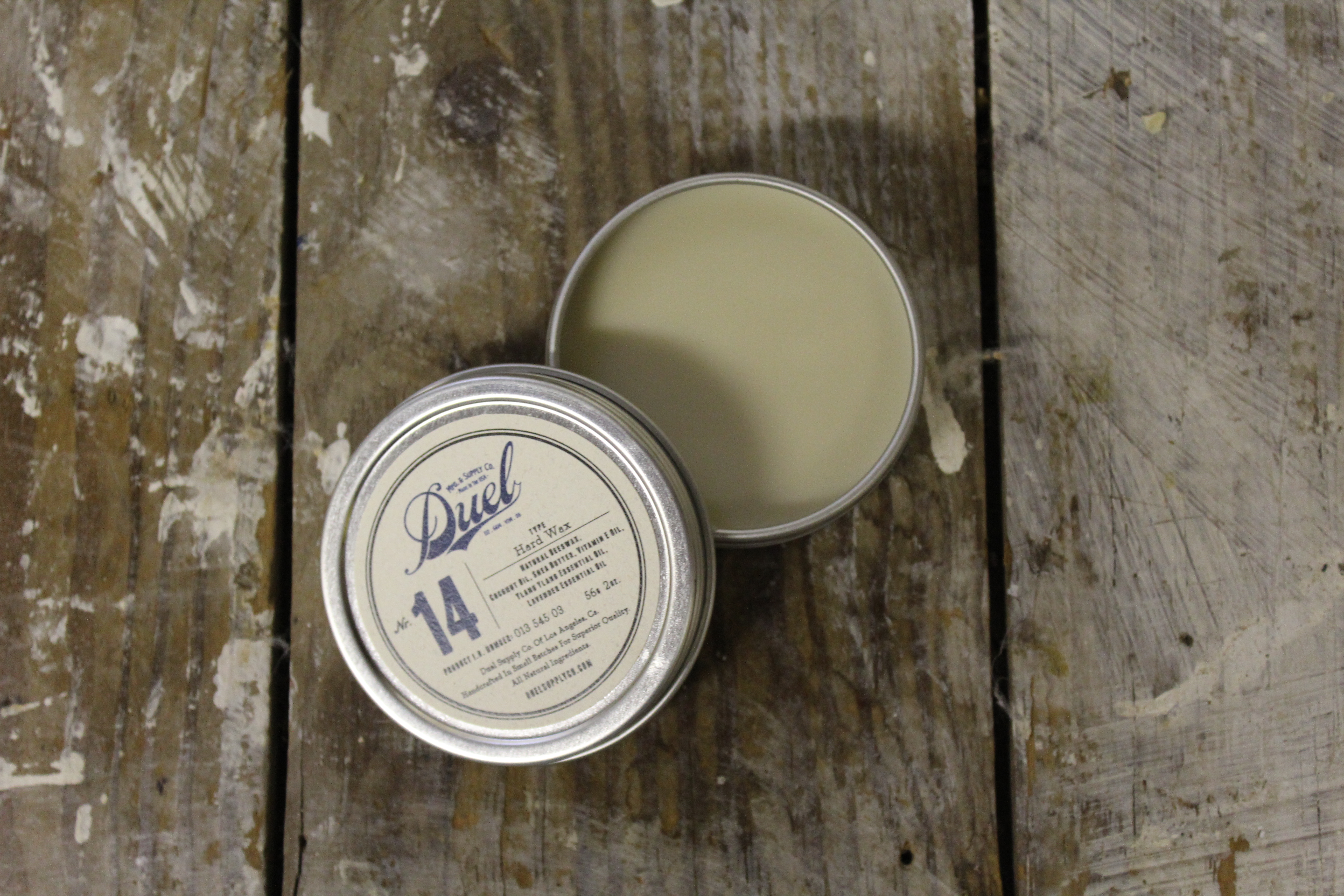 Duel Hard Wax No. 14 — open tin on raw wood